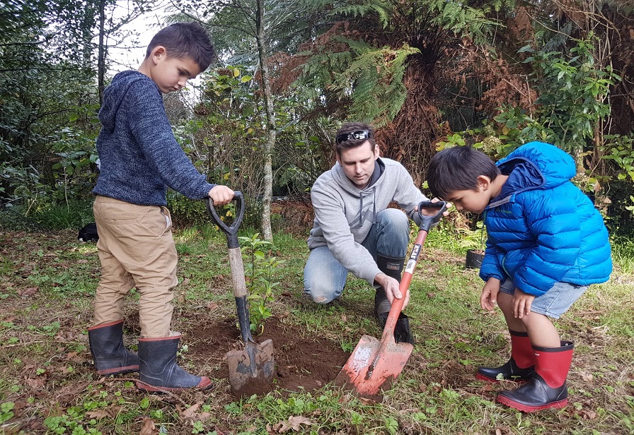 Brennan and kids planting web